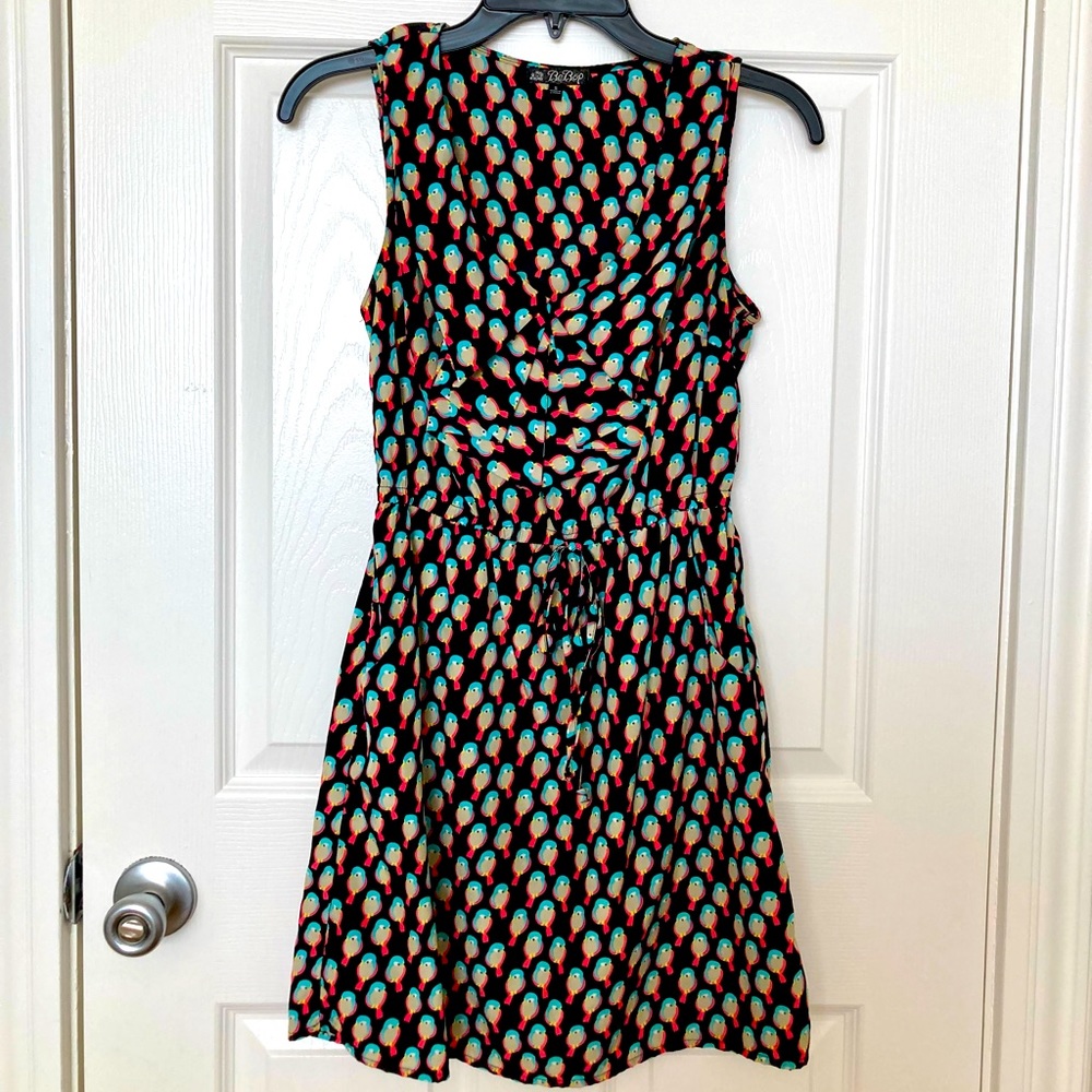 Sleeveless black dress with birds